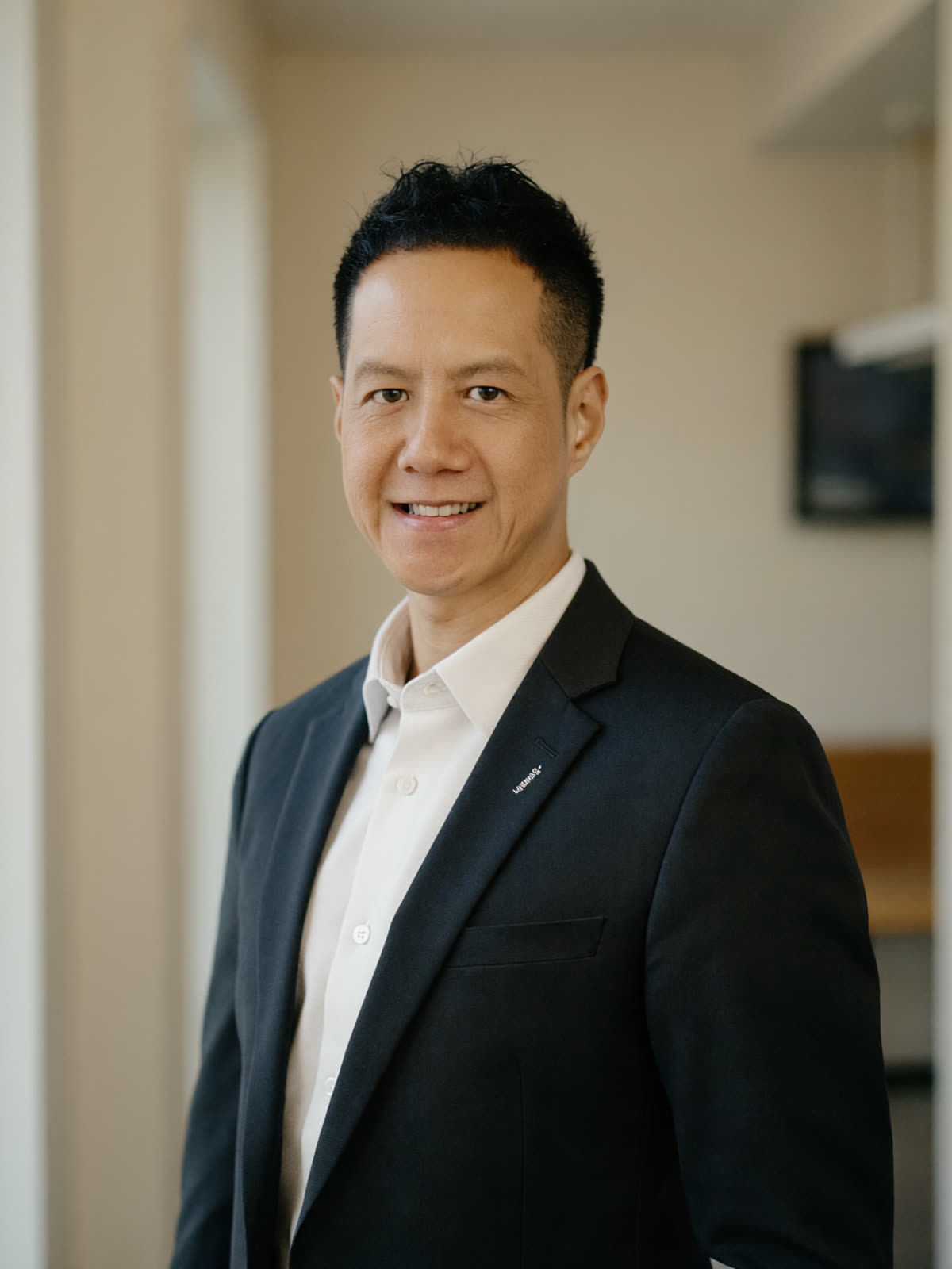 An editorial portrait of a Singaporean property specialist